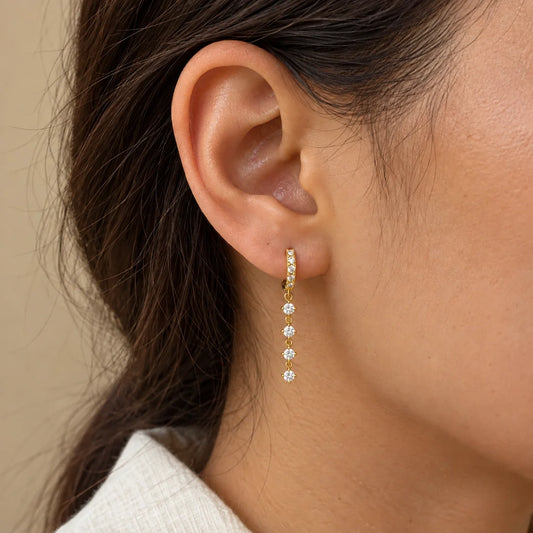 Crystal Line Piercing worn on an adult model ear