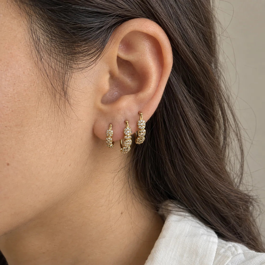 Crystal Rosette Hoops Set worn on an adult model ear