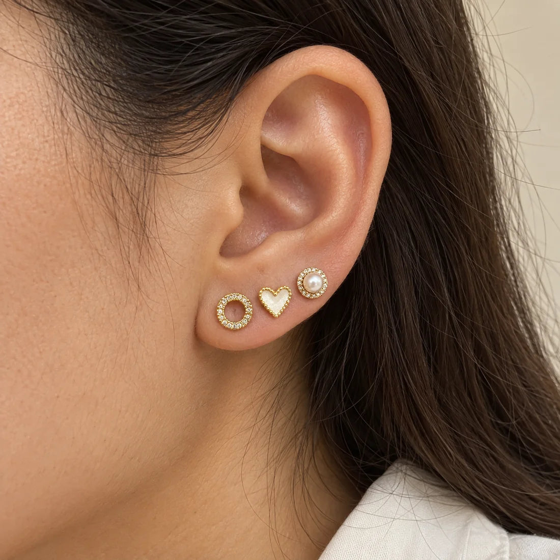 Pearl Heart Stud Set worn on an adult model ear
