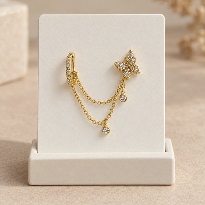 Butterfly Cascade Piercing displayed on an ivory jewelry card