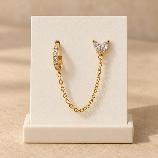 Butterfly Link Piercing displayed on an ivory jewelry card