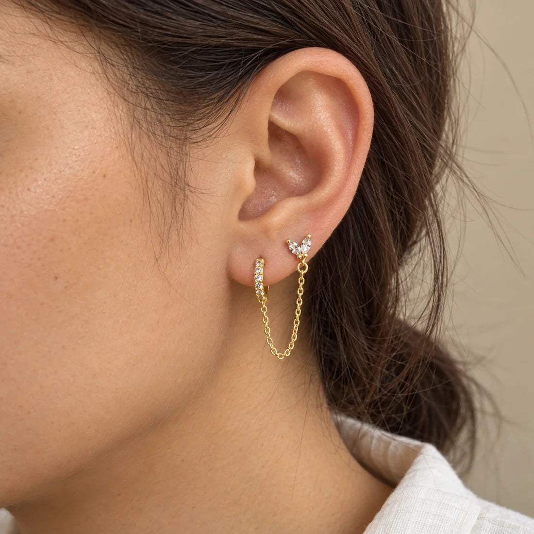 Butterfly Link Piercing worn on an adult model ear