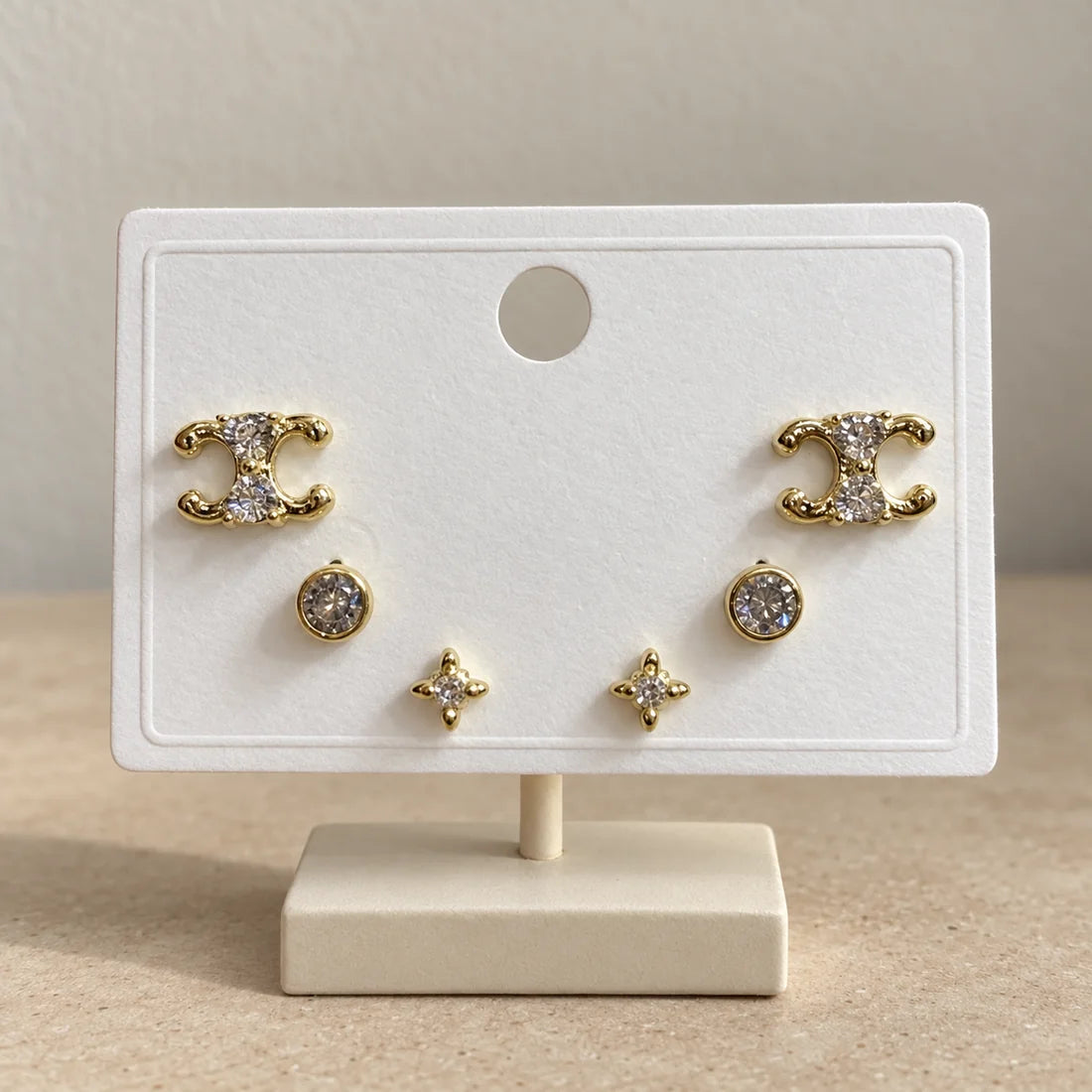 Celestial Curves Stud Set displayed on an ivory jewelry card