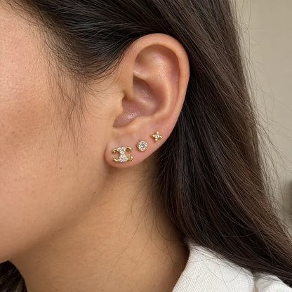 Celestial Curves Stud Set worn on an adult model ear