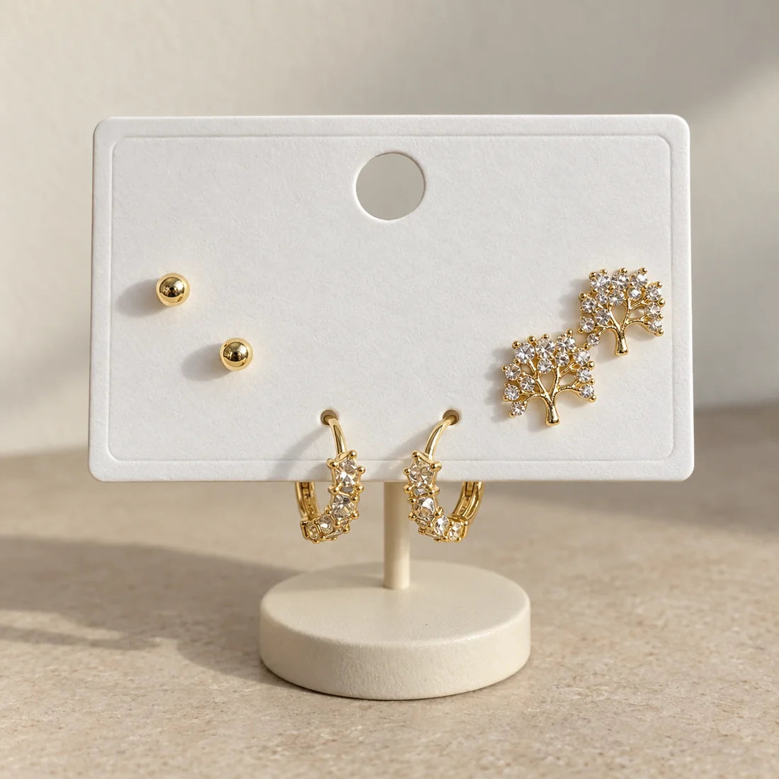 Crystal Blossom Hoops Set displayed on an ivory jewelry card
