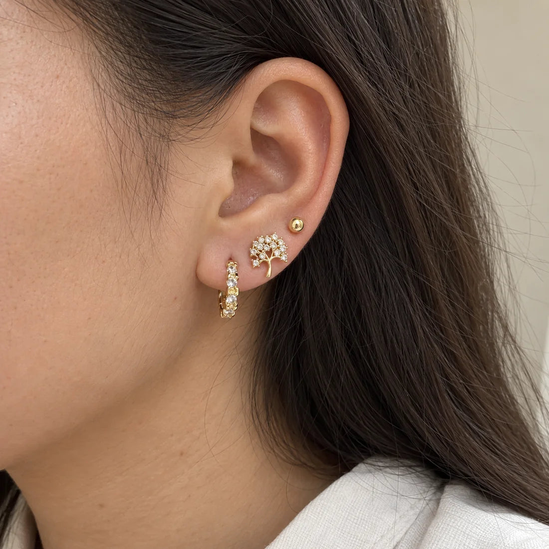 Crystal Blossom Hoops Set worn on an adult model ear
