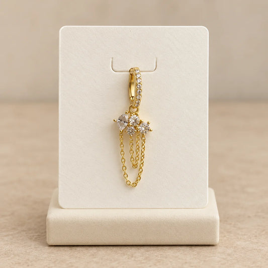 Crystal Garland Chain Piercing displayed on an ivory jewelry card