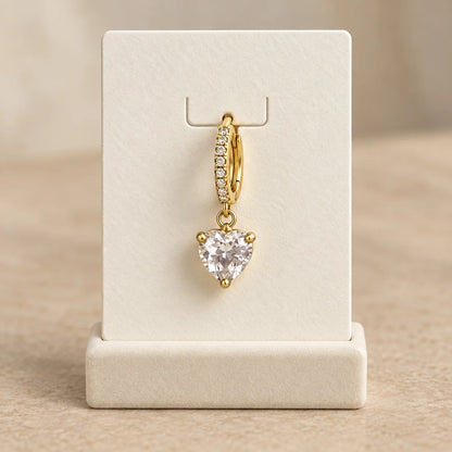Crystal Heart Piercing displayed on an ivory jewelry card