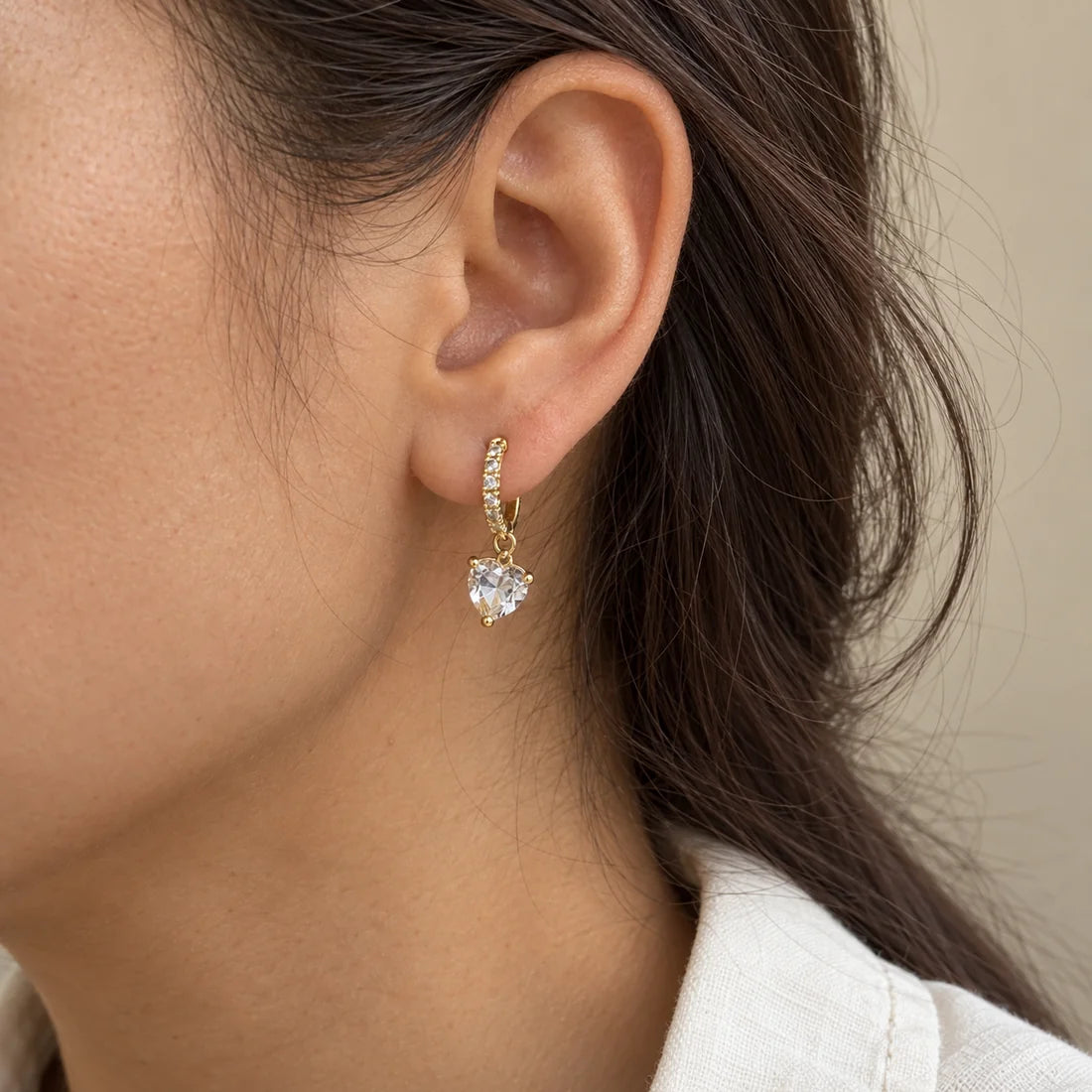 Crystal Heart Piercing worn on an adult model ear