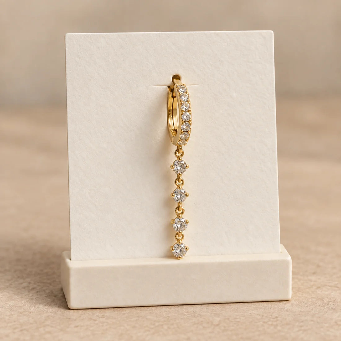 Crystal Line Piercing displayed on an ivory jewelry card
