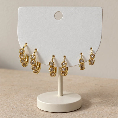 Crystal Rosette Hoops Set displayed on an ivory jewelry card