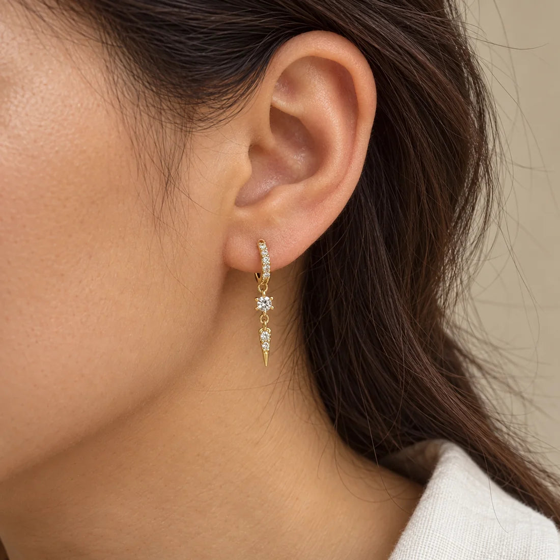 Crystal Spear Piercing worn on an adult model ear