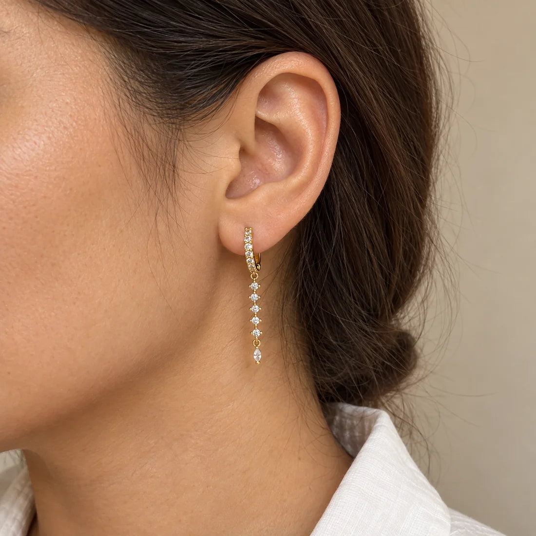 Crystal Stream Piercing worn on an adult model ear