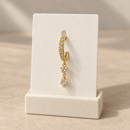 Dewdrop Duo Piercing displayed on an ivory jewelry card