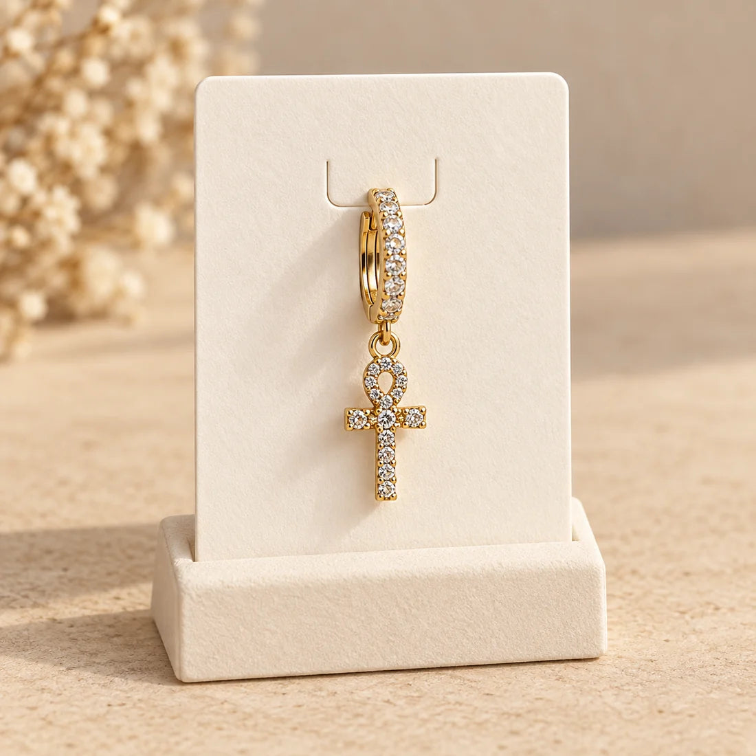 Golden Ankh Piercing displayed on an ivory jewelry card