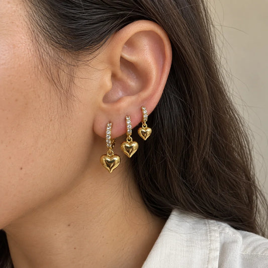 Golden Heart Hoops Set worn on an adult model ear