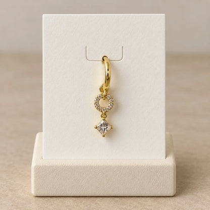 Orbit Square Piercing displayed on an ivory jewelry card