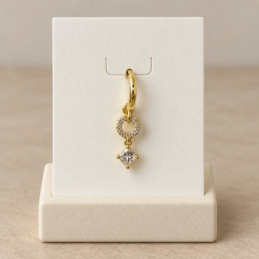 Orbit Square Piercing displayed on an ivory jewelry card