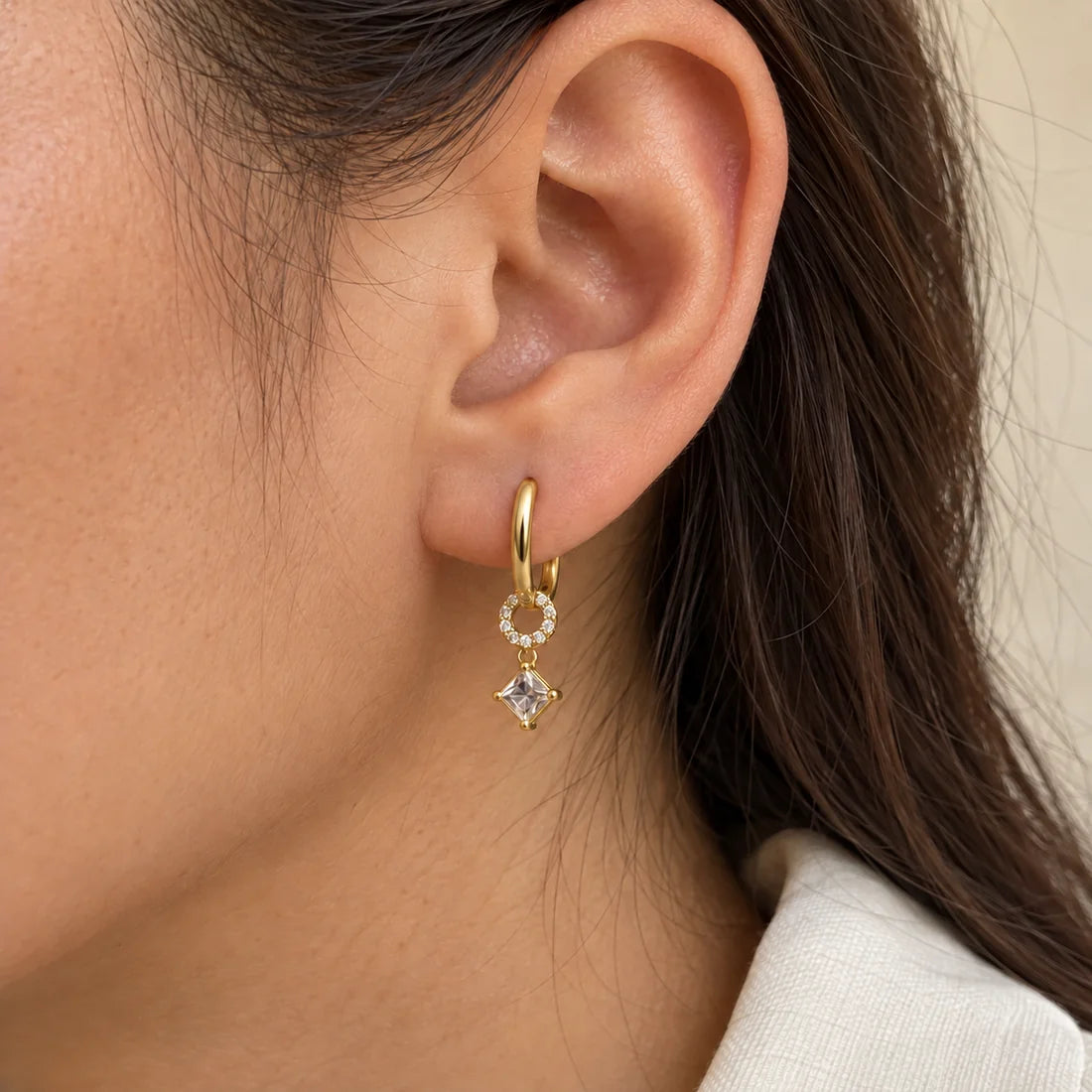 Orbit Square Piercing worn on an adult model ear