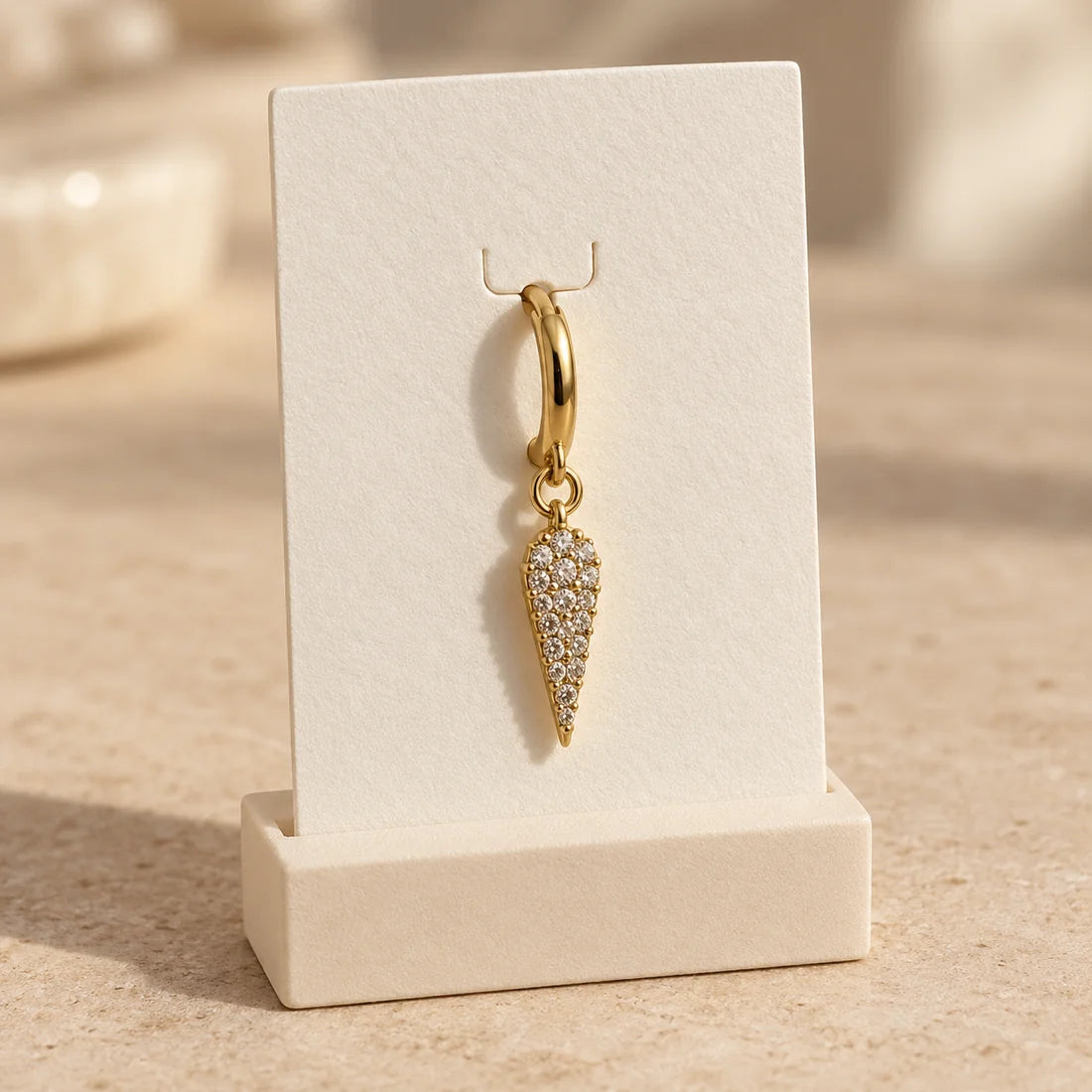 Pave Dagger Piercing displayed on an ivory jewelry card