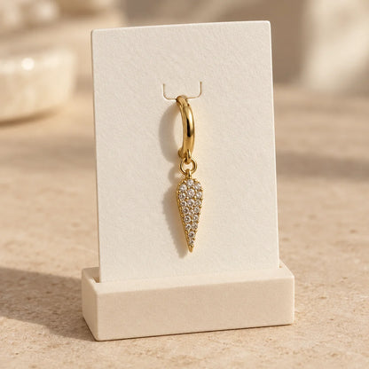 Pave Dagger Piercing displayed on an ivory jewelry card