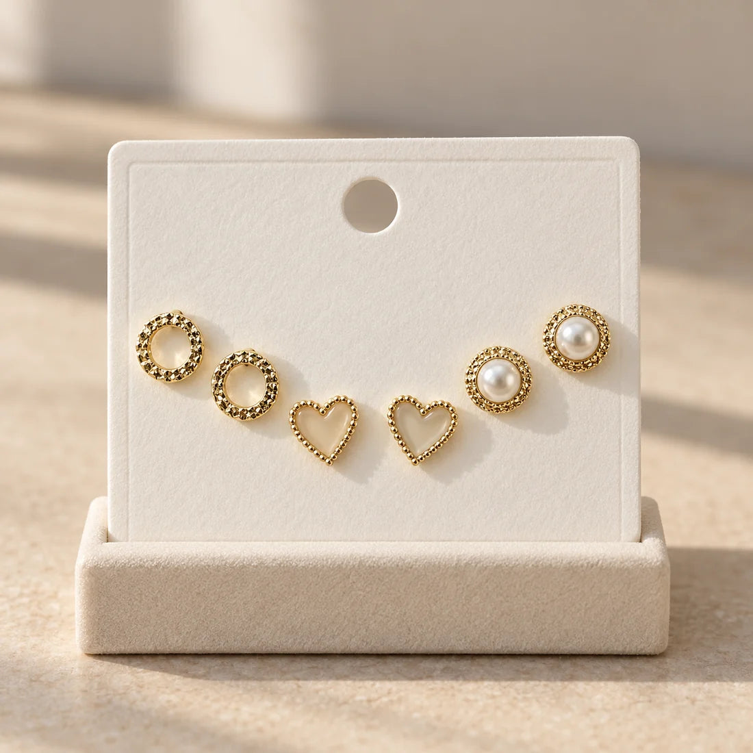 Pearl Heart Stud Set displayed on an ivory jewelry card