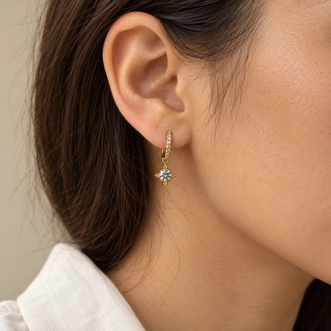Solar Halo Piercing worn on an adult model ear