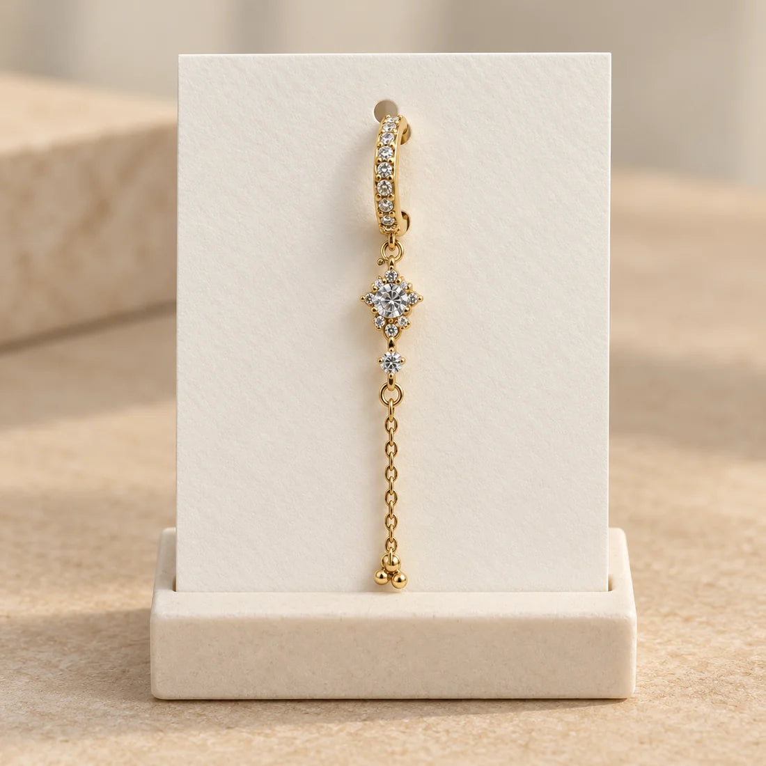 Starlight Trail Piercing displayed on an ivory jewelry card