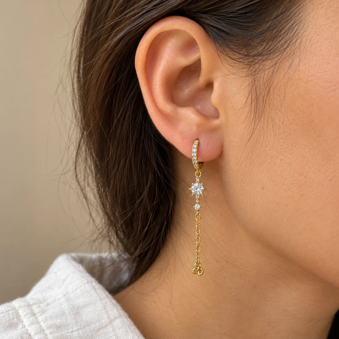 Starlight Trail Piercing worn on an adult model ear