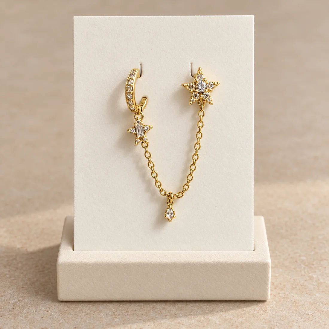 Stellar Link Piercing displayed on an ivory jewelry card