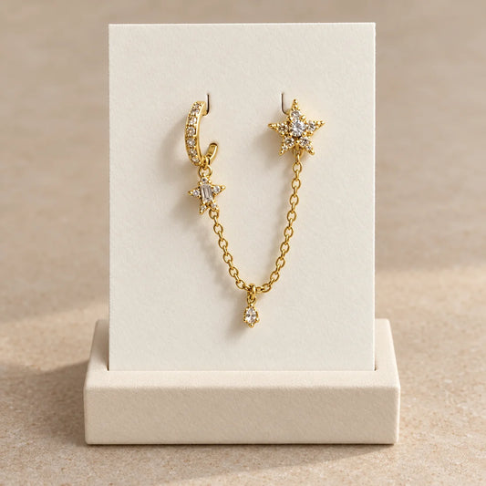 Stellar Link Piercing displayed on an ivory jewelry card