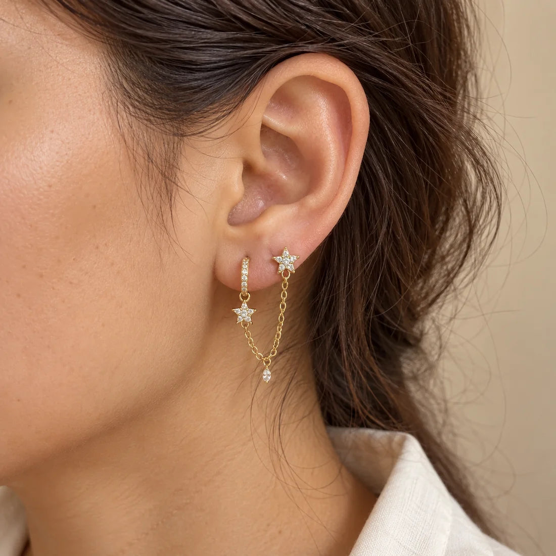 Stellar Link Piercing worn on an adult model ear