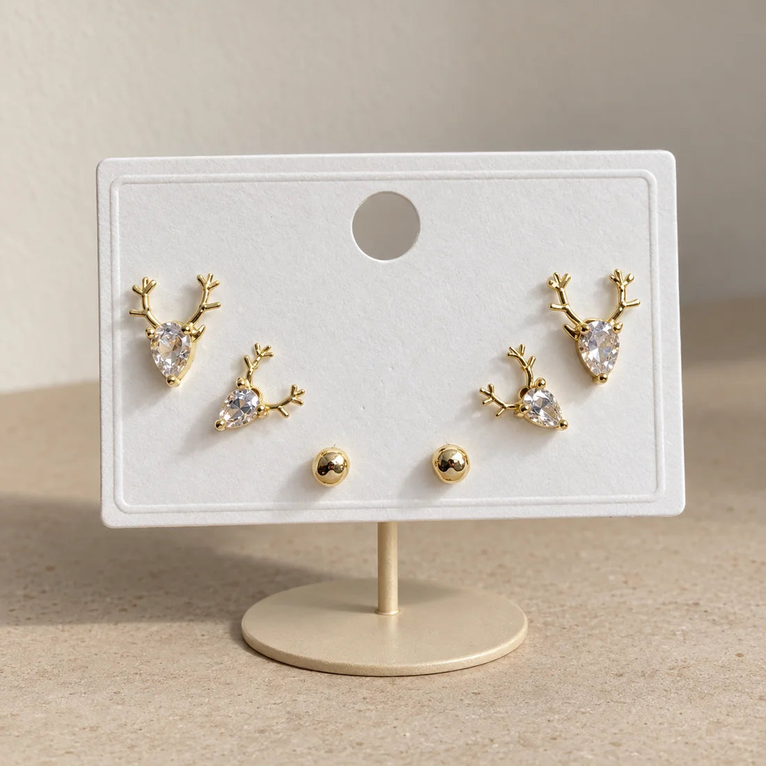 Woodland Deer Stud Set displayed on an ivory jewelry card
